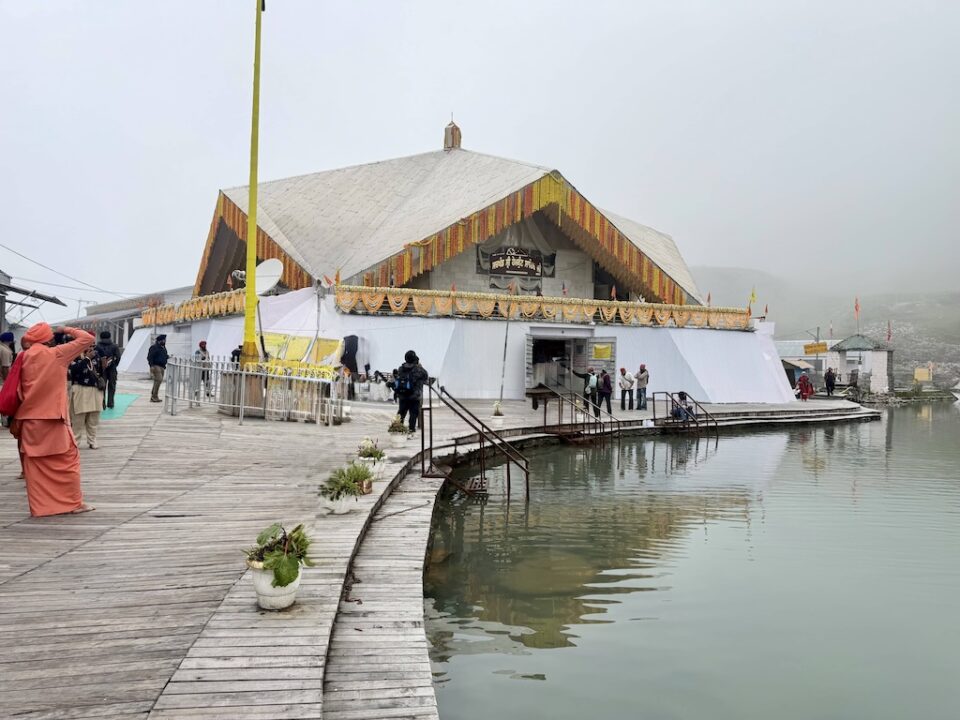 The Hemkund Sahib Gurdwara and the sarovar, marigold garlands along the roof