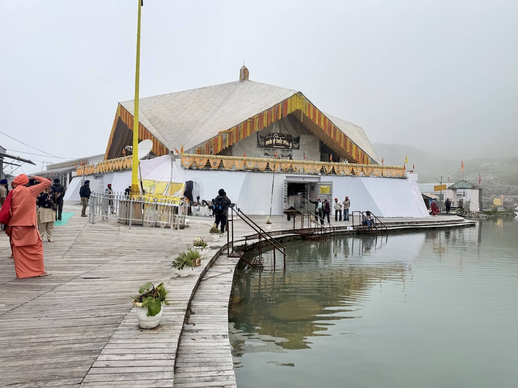 The Hemkund Sahib Gurdwara and the sarovar, marigold garlands along the roof