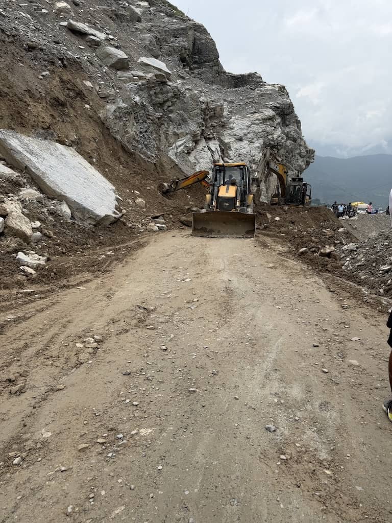 Bulldozers clearing the landslide at Gundala